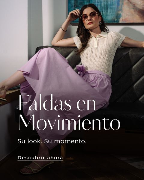 La modelo posa con una falda morada vaporosa y una parte superior de color crema. Texto: "Faldas en Movimiento. Su look. Su momento. Descubrir ahora.